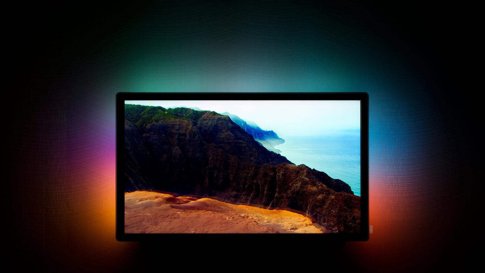 Ambient lighting in action: a TV glowing colors onto the wall behind it